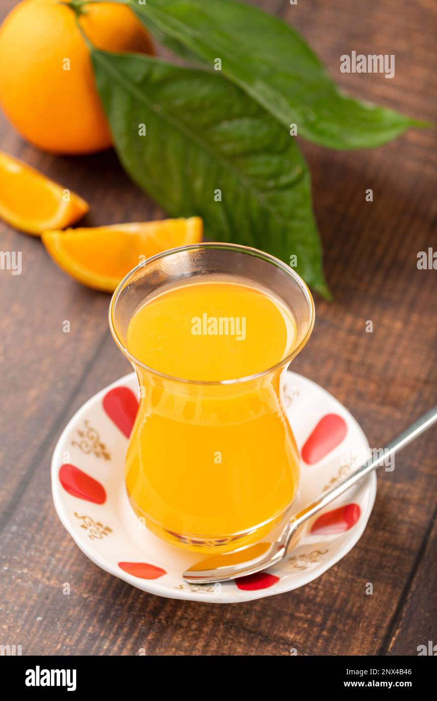 Winter drink orange oralet or oralette in a thin-waisted glass tea ...