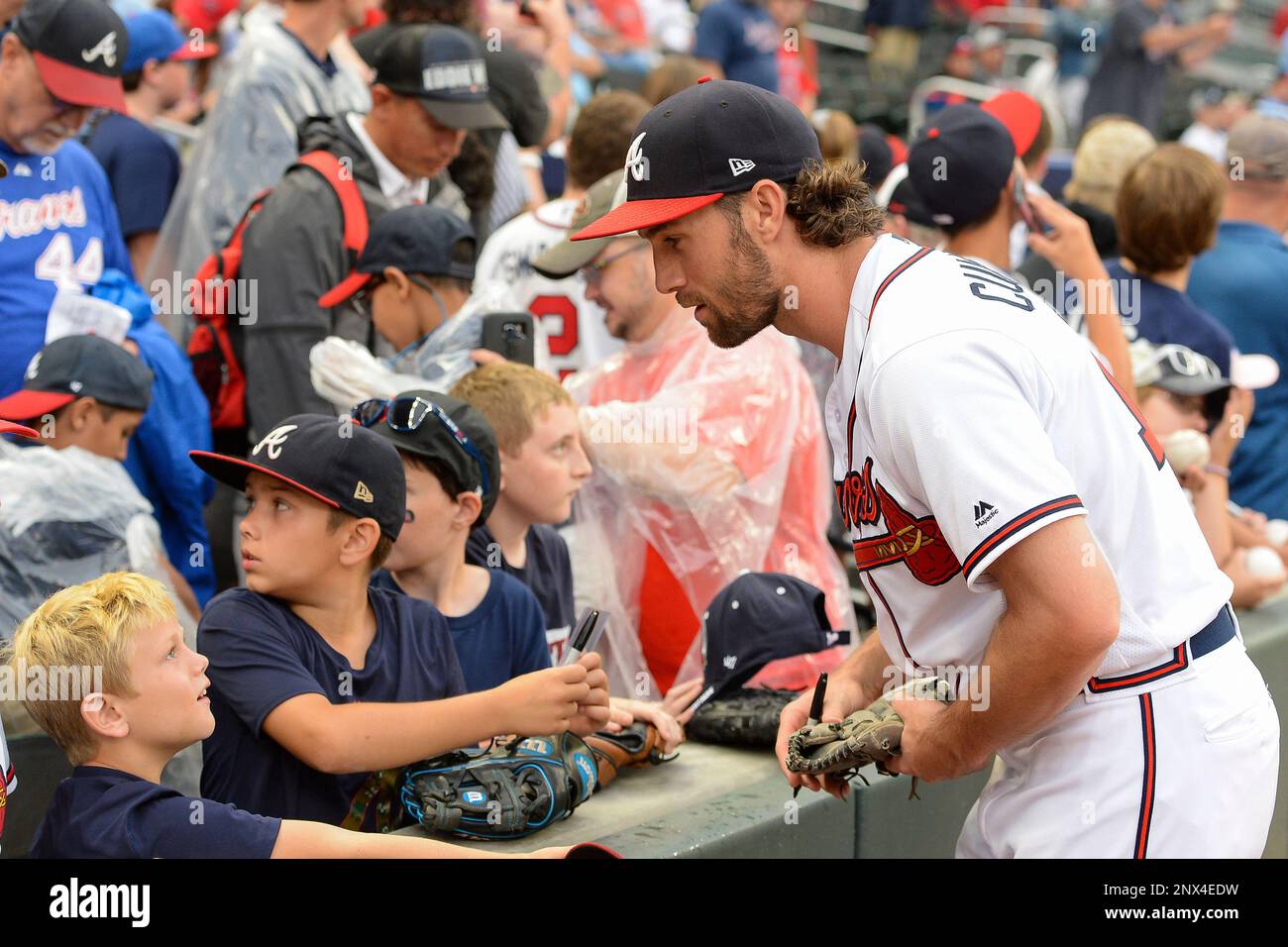 ATLANTA, GA – JUNE 01: Atlanta's Charlie Culberson (16) signs autographs  for fans prior to the start of the game between Atlanta and Washington on  June 1st, 2018 at SunTrust Park in