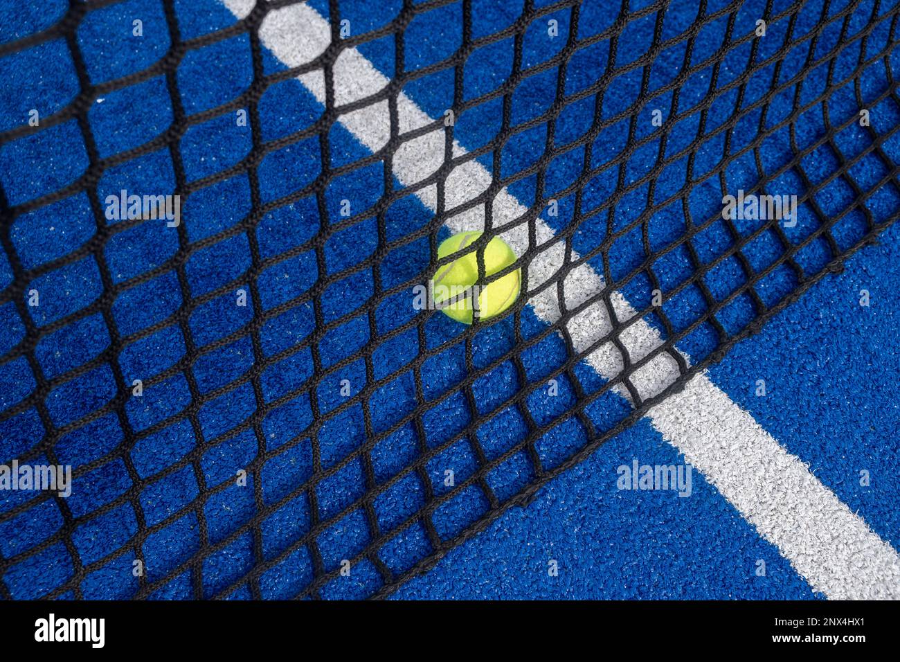 ball behind the net of a paddle tennis court Stock Photo Alamy