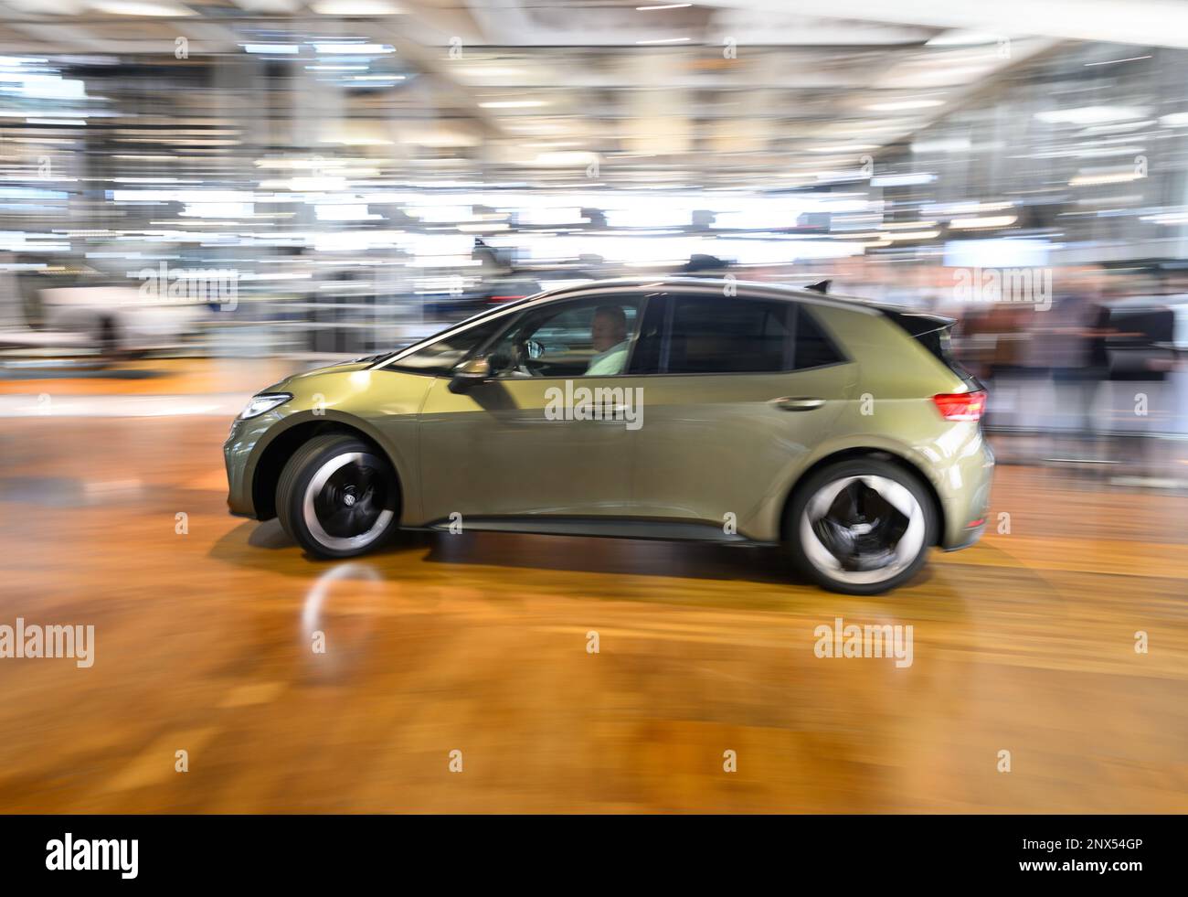 01 March 2023, Saxony, Dresden: The new VW ID.3. drives along the Gläserne  Manufaktur during a photo session to mark the digital world premiere of the  electric model. The ID.3. gets an