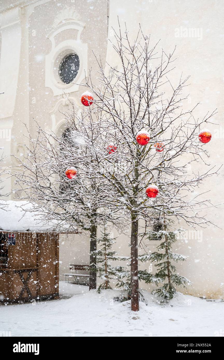 Under a dense snowfall in the streets of San Candido. Val Pusteria Stock Photo