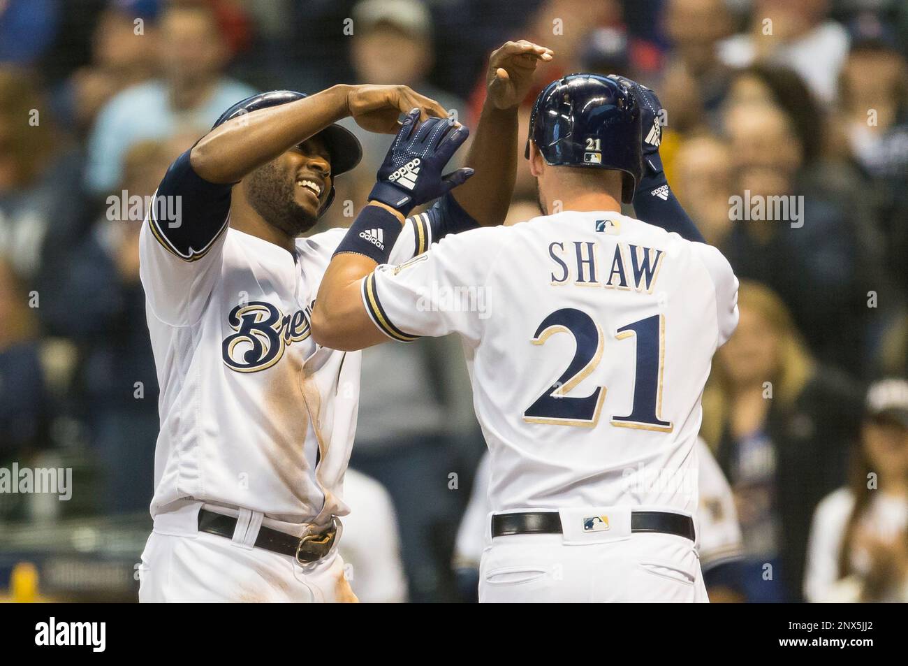 Milwaukee Brewers' Travis Shaw slides safely under the swipe tag by  Pittsburgh Pirates catcher Francisco Cervelli during the fourth inning of a  baseball game in Pittsburgh, Monday, July 17, 2017. Shaw scored