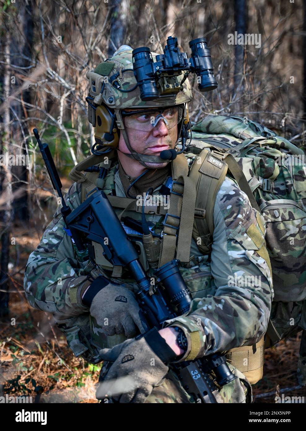A U.S. Airman from the 165th Air Support Operations Squadron secures his location at Townsend Bombing Range, Georgia, while working as a sensing and effects team during exercise Sunshine Rescue on Jan. 24, 2023. The goal of the Sunshine Rescue 2023 exercise is to execute traditional Combat Search and Rescue (CSAR) capabilities with forward-edge ground force tactics, techniques, and procedures while utilizing advanced command and control technologies. Stock Photo