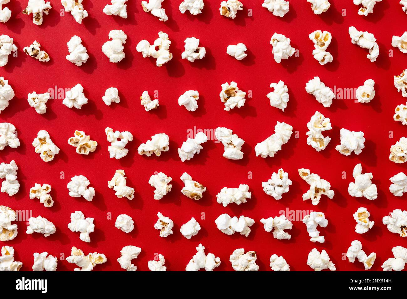 Popcorn pattern on red background Stock Photo