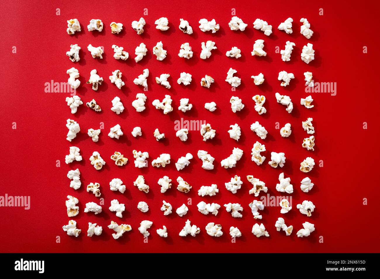 Popcorn pattern on red background Stock Photo