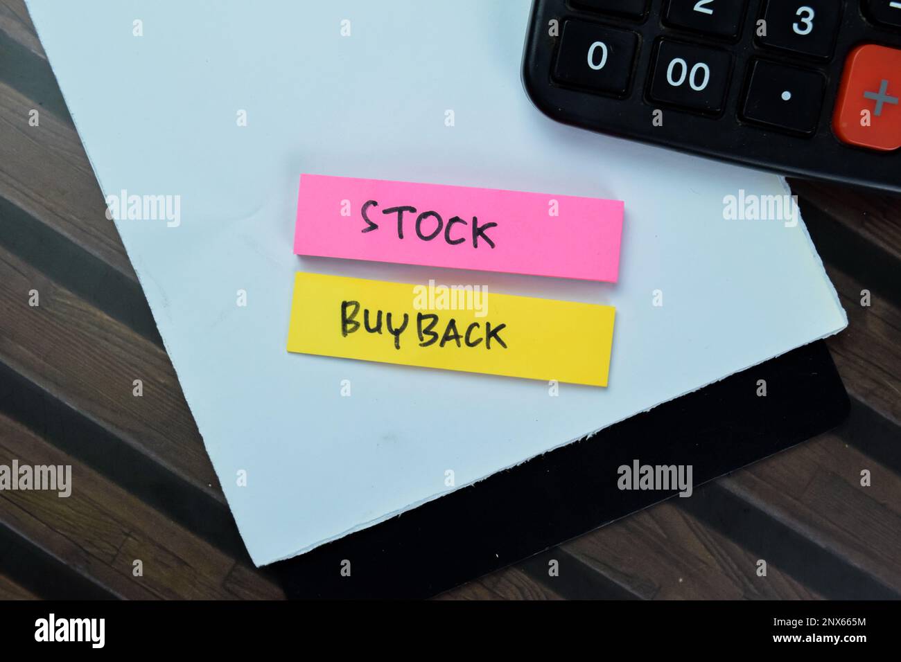 Concept of Stock Buyback write on sticky notes with calculator isolated