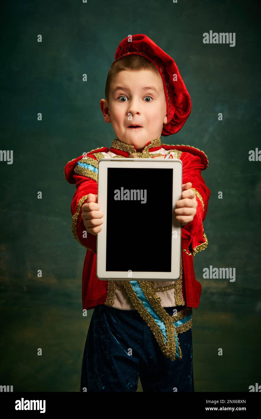 One cute little boy dressed up as medieval little prince and pageboy
