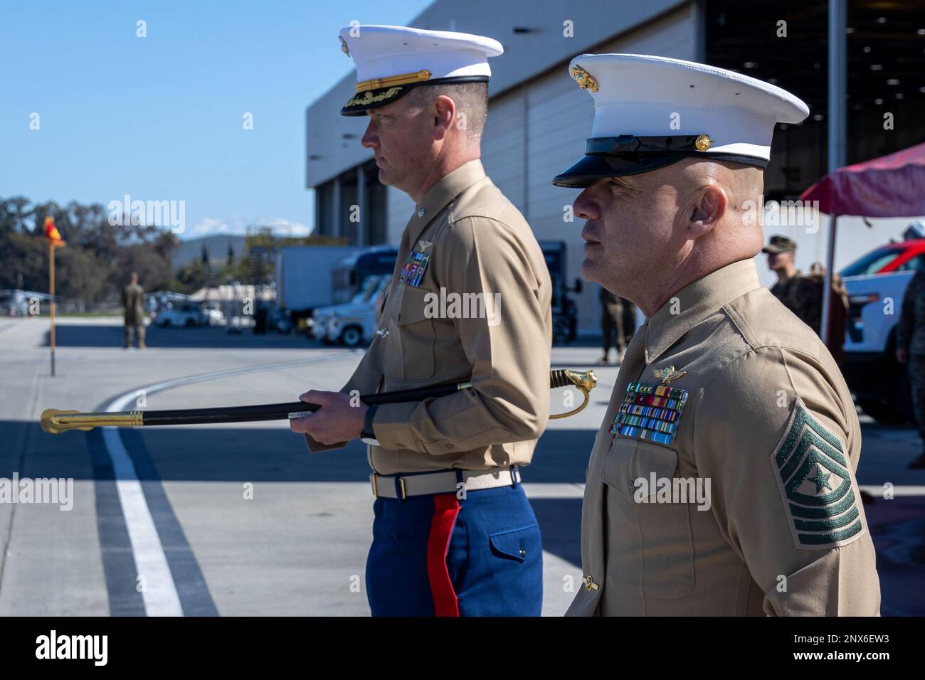 U.S. Marine Corps Lt. Col. Stephen Borrett, left, the commanding officer for Headquarters and Headquarters Squadron, Marine Corps Air Station Camp Pendleton, and Sgt. Maj. David Gonzalez, the outgoing sergeant major for H&HS, MCAS Camp Pendleton, stand at attention during a relief and appointment ceremony on MCAS Camp Pendleton, California, Feb. 15, 2023. After two years of serving his role as sergeant major for H&HS, MCAS Camp Pendleton, Gonzalez relinquished his duties to Sgt. Maj. Robert Catching, the incoming sergeant major. Stock Photo