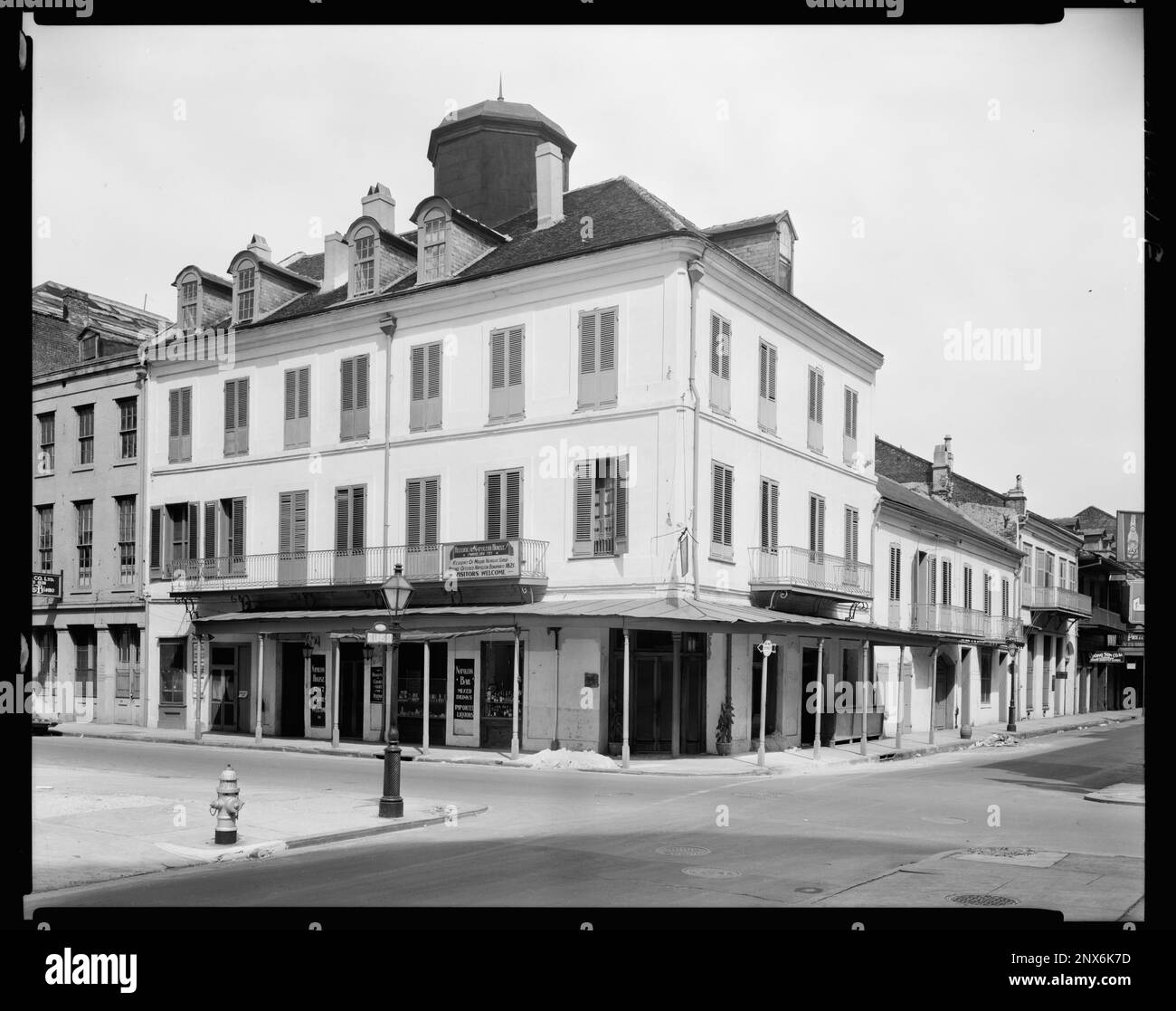 Girod House, 502 Chartres St., New Orleans, Orleans Parish, Louisiana. Carnegie Survey of the Architecture of the South. United States, Louisiana, Orleans Parish, New Orleans,  Balconies,  Buildings,  Cupolas,  Dormers,  Fire hydrants,  Lampposts. Stock Photo