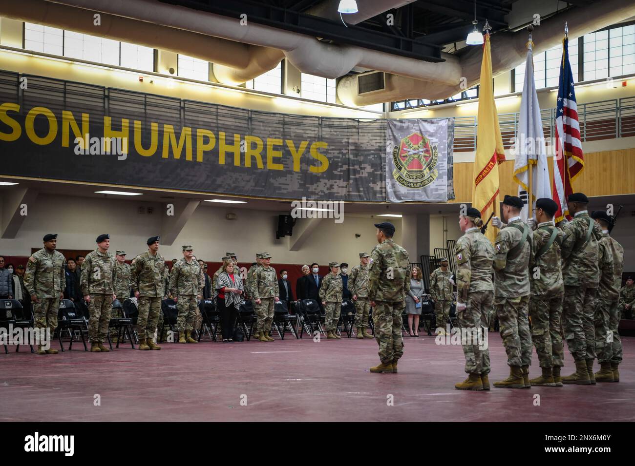 U.S. Army Garrison Humphreys Command team stands in front of the USAG