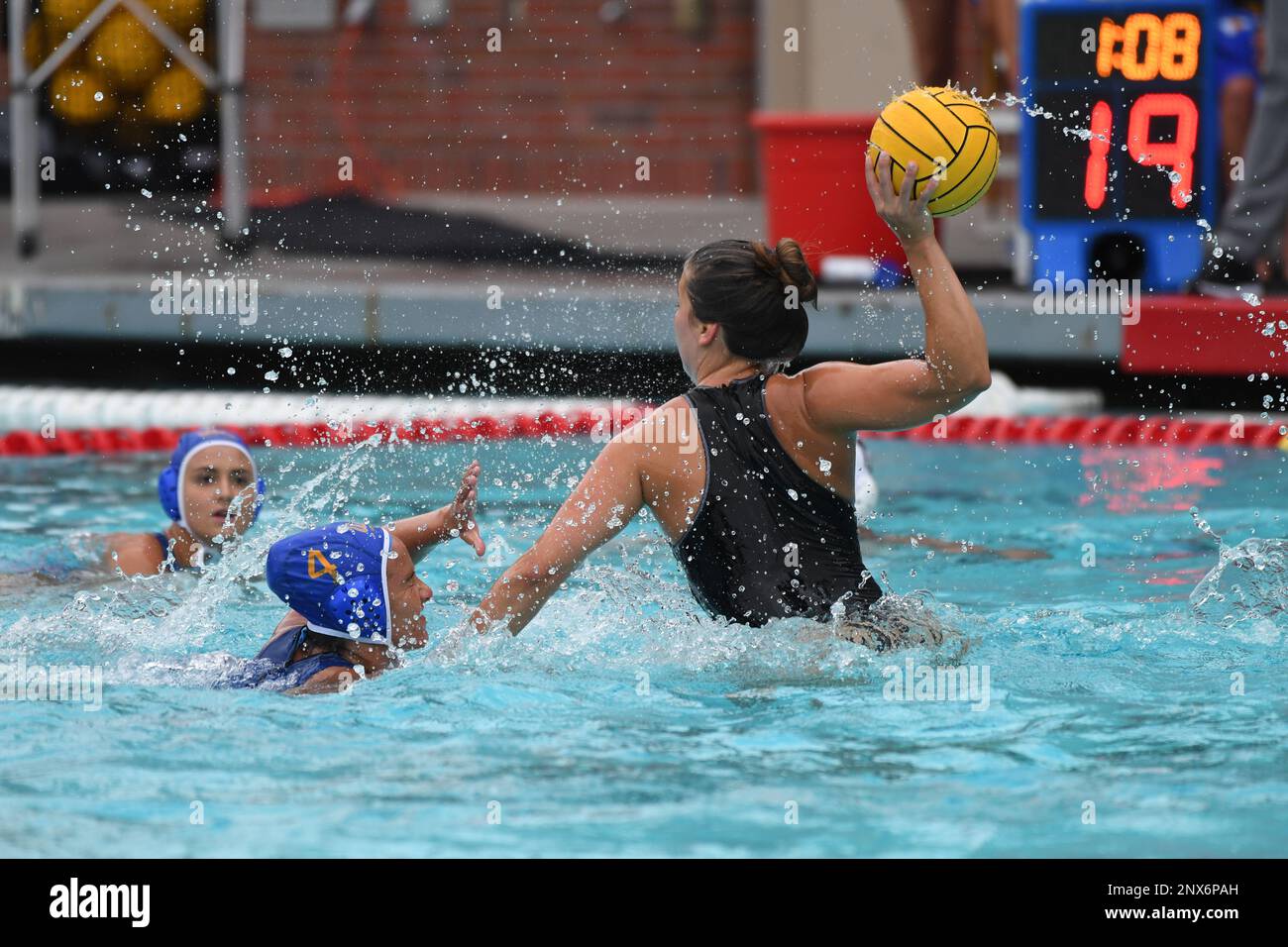Pacific Tigers attacker Mariana Duarte (5) is defended by UCLA Bruins