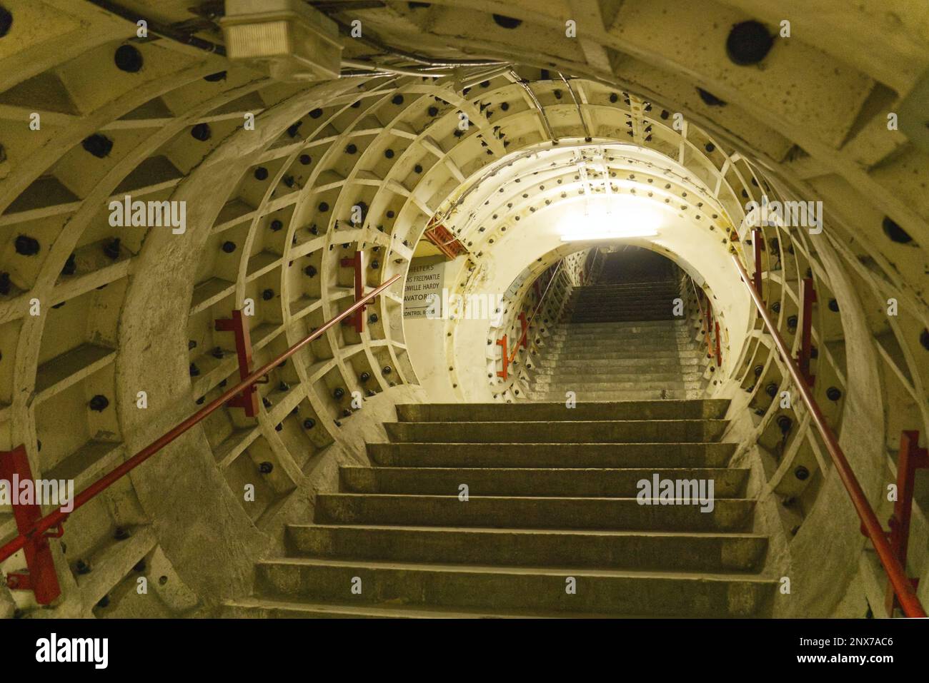 London, England, UK - Stairs to shelters, facilities and exit inside Clapham South Deep-Level Shelter built in World War II as air-raid shelter Stock Photo