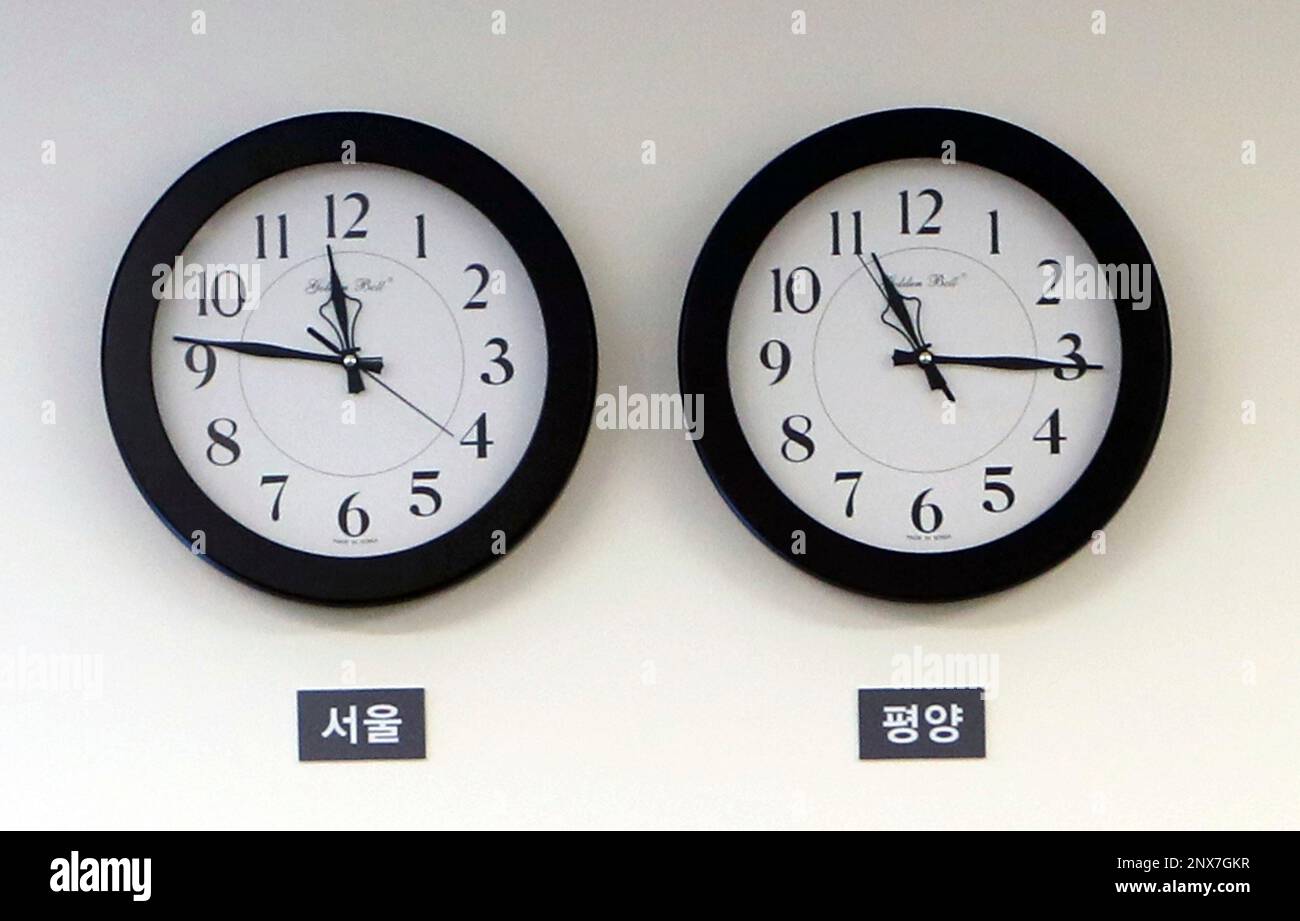In this April 27, 2018 photo, Seoul time zone clock, left, and