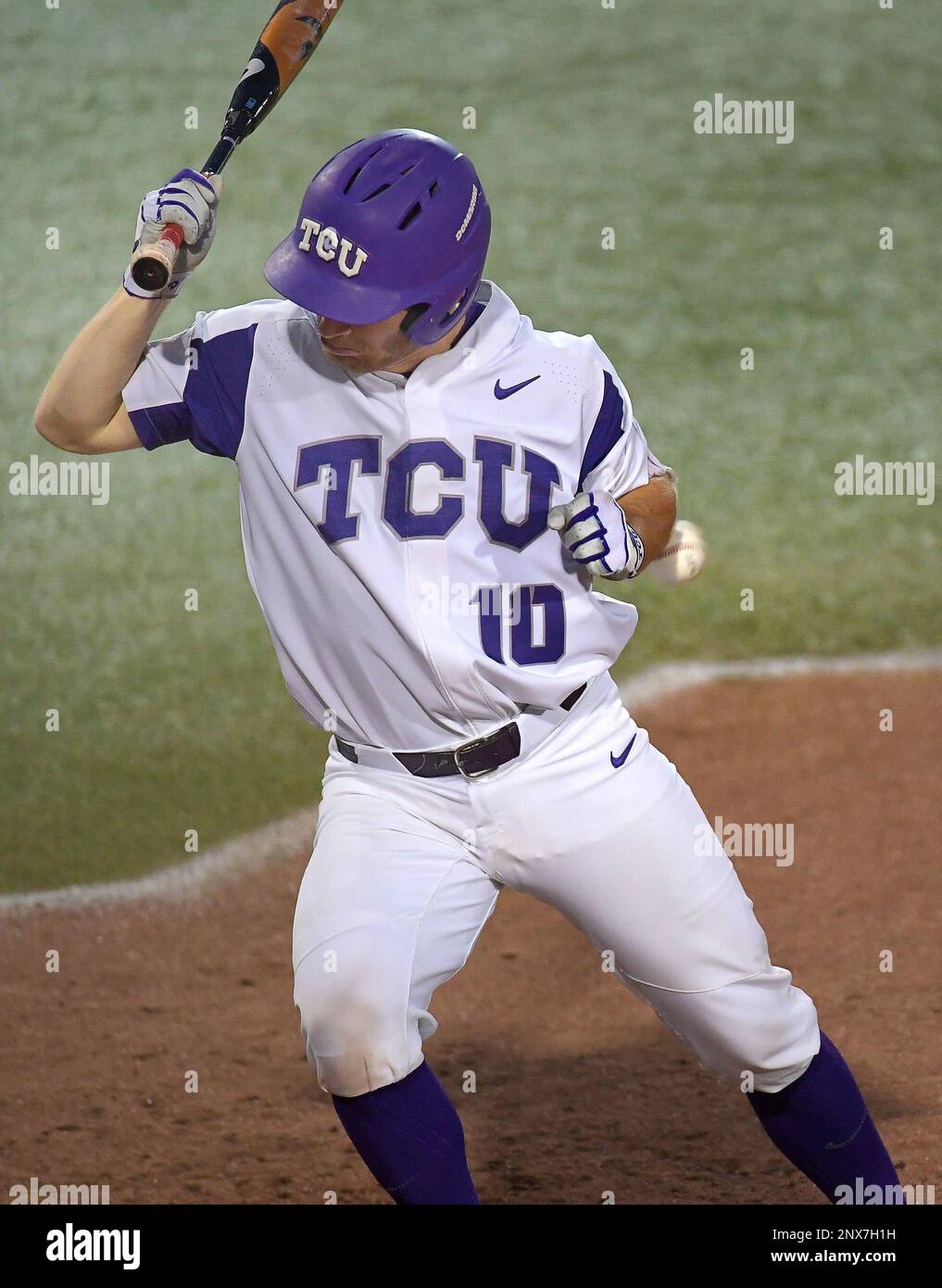 TCU's Zach Humphreys (10) is hit by a pitch by Lamar's Tanner Driskill