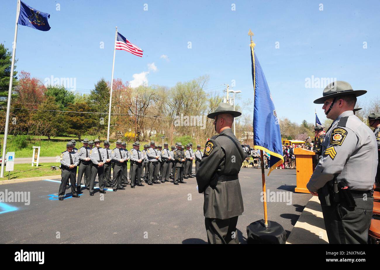 Pennsylvania State Police Troopers stand at attention during the