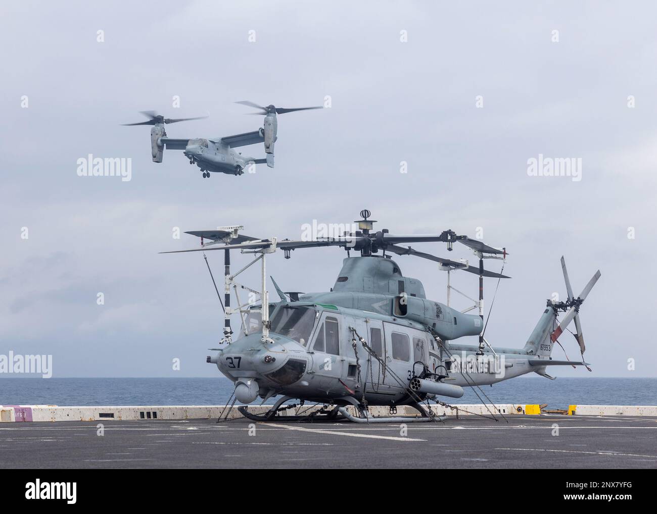 SOUTH CHINA SEA (Jan. 5, 2023) – U.S. Marine Corps MV-22B Osprey pilots with Marine Medium Tiltrotor Squadron (VMM) 362 (Rein.), 13th Marine Expeditionary Unit, approach the flight deck of amphibious transport dock USS Anchorage (LPD 23), Jan. 5. The ability to operate seamlessly and simultaneously on the sea, ashore, and in the air represents the unique value of the amphibious capability provided by the Navy-Marine Corps team. 7th Fleet is the U.S. Navy's largest forward-deployed numbered fleet, and routinely interacts and operates with Allies and partners in preserving a free and open Indo-P Stock Photo