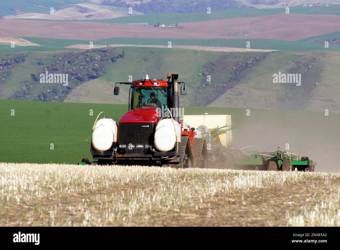 In this Thursday, April 19, 2018 photo, Eric Odberg seeds a field on