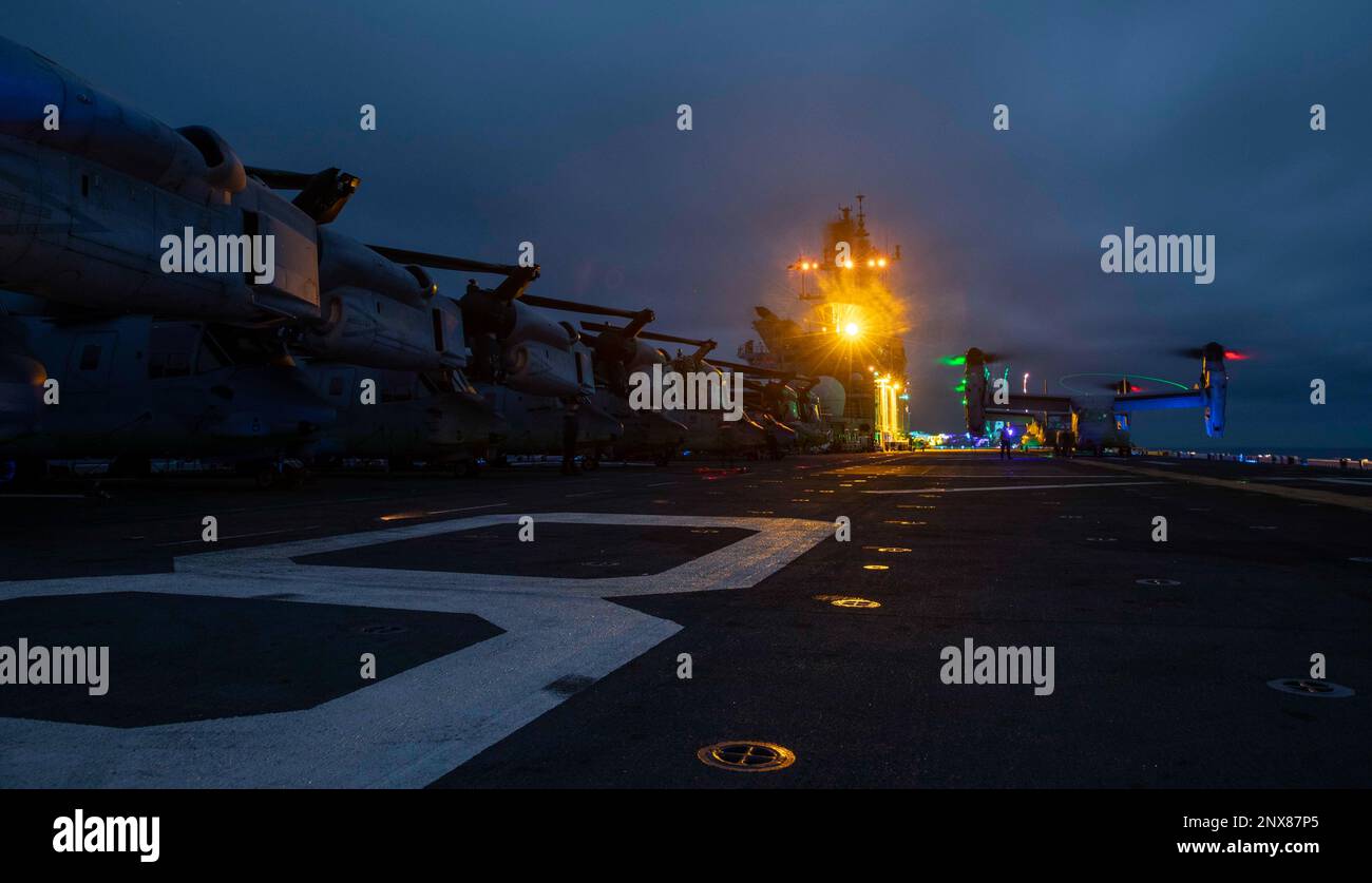 230102-N-EI127-1154    SOUTH CHINA SEA (Jan. 2, 2023) – An MV-22 Osprey, assigned to Marine Medium Tiltrotor Squadron (VMM) 362 (Rein.), 13th Marine Expeditionary Unit, prepares to take off the flight deck of amphibious assault ship USS Makin Island (LHD 8), Jan. 2, 2023. Makin Island is designed to field an integrated amphibious force that can support operational commanders around the globe with both strike and amphibious capabilities. The Makin Island Amphibious Ready Group, comprised of amphibious assault ship USS Makin Island (LHD 8) and amphibious transport docks USS Anchorage (LPD 23) an Stock Photo