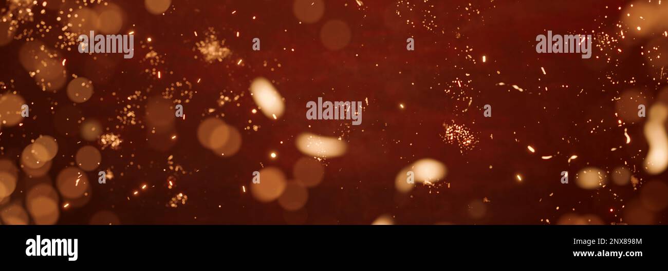festive abstract red background with yellow glitter particles Stock Photo