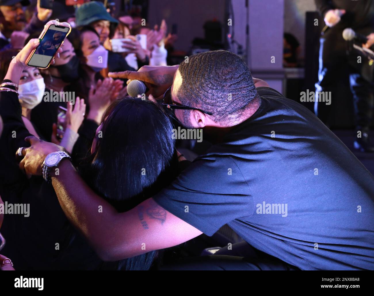 Dru Hill member Scola poses for a selfie with an audience member during the group’s concert Jan. 10 at the Camp Zama Community Club at Camp Zama, Japan. The group was in Japan as part of a tour of U.S. military bases in Asia in conjunction with Armed Forces Entertainment. Stock Photo