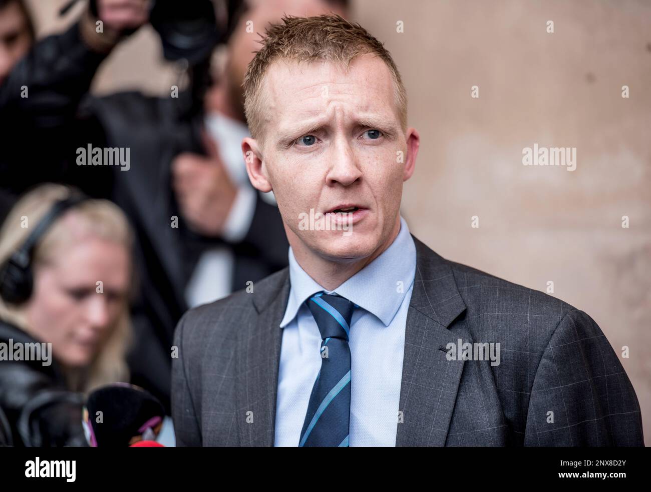 Prosecutor Jakob BuchJepsen at a press briefing in front of the