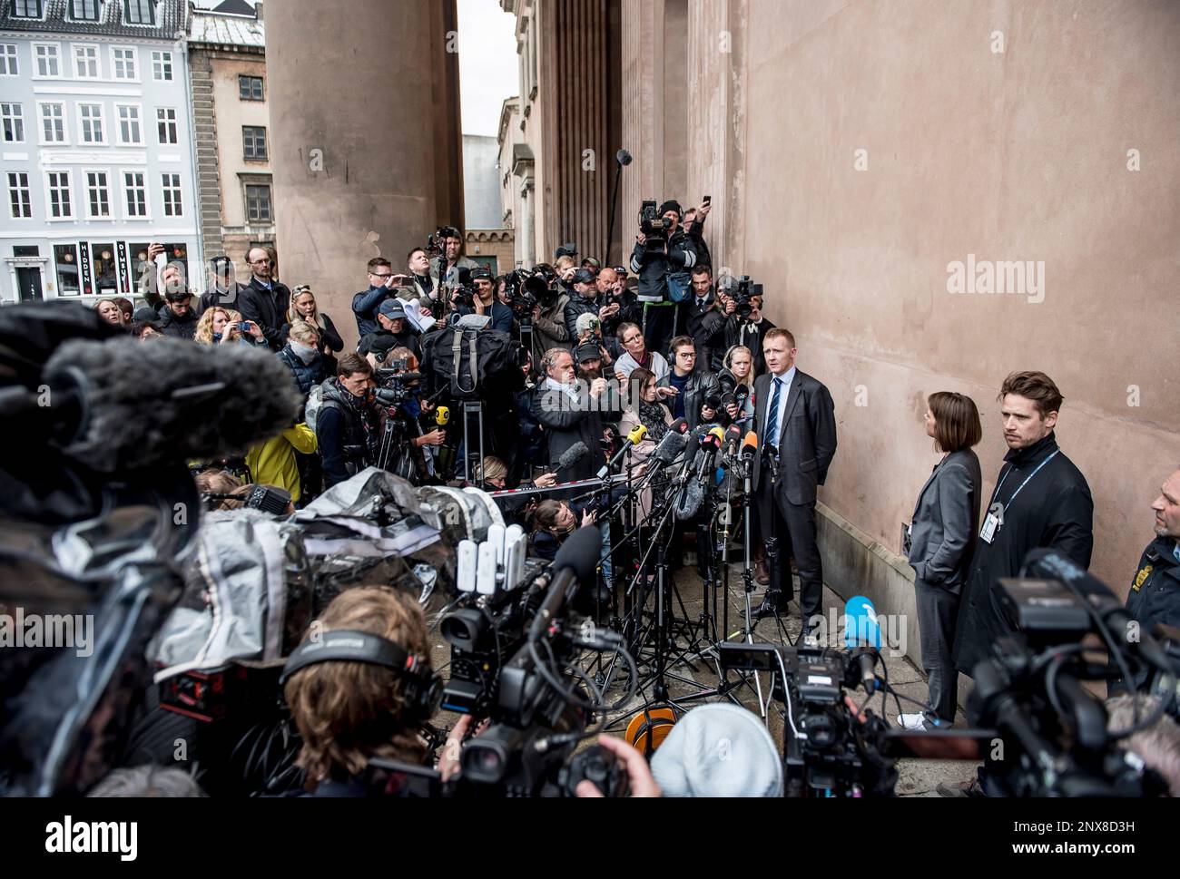 Prosecutor Jakob BuchJepsen at a press briefing in front of the