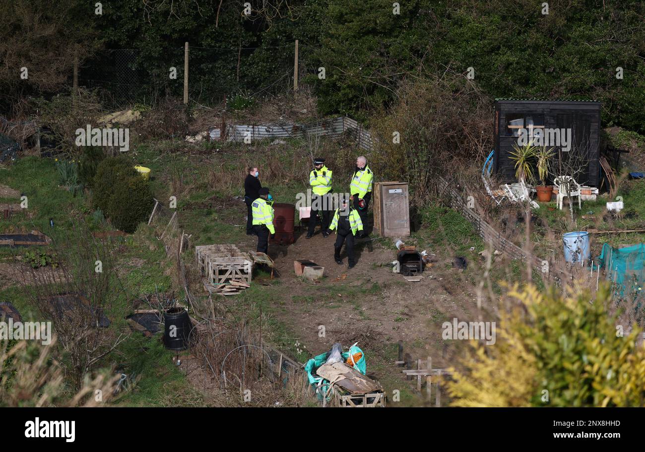 Police searching allotments for baby Victoria Marten after the arrest of her mother Constance Marten and her partner Mark Gordon. Police officers and Crime Scene investigators were seen looking into a brazier oil drum on the site of a camp within the allotments. The body of Victoria was found a day later hidden wrapped in a plastic bag in a nearby shed. Picture by James Boardman Stock Photo
