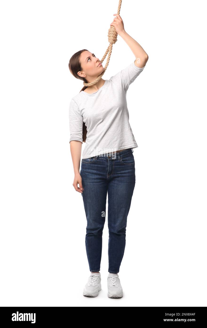 Depressed woman with rope noose on neck against white background Stock Photo