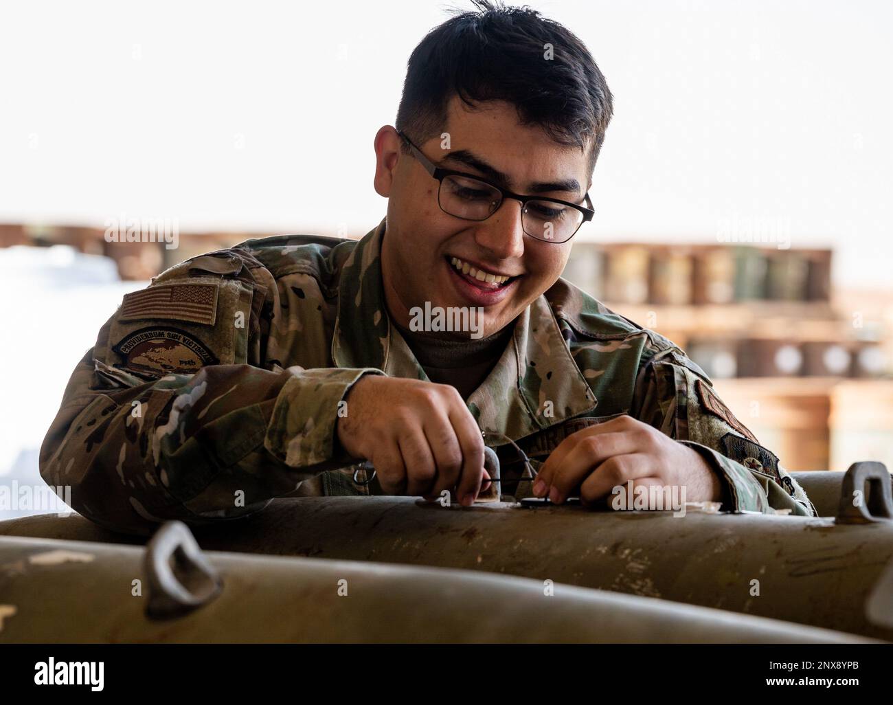 U.S. Air Force Senior Airman Johnny Barreto, assigned to the 378th Expeditionary Contracting Squadron, disassembles a GBU-12 Paveway II bomb at Prince Sultan Air Base, Saudi Arabia, Feb. 15, 2023. The GBU-12 is an American aerial laser-guided bomb, with a nose-mounted laser seeker and fins for guidance. Stock Photo