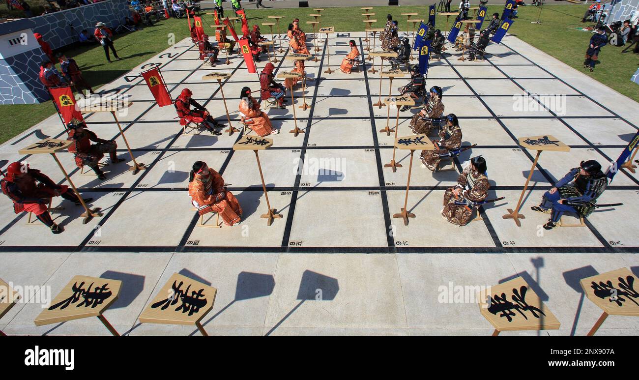 Local high school students perform Ningen Shogi, human Japanese chess on  top of Mt. Maizuru, in Tendo, Yamagata Prefecture on April 22, 2017. Tendo  is known for production of shogi koma,'' pieces