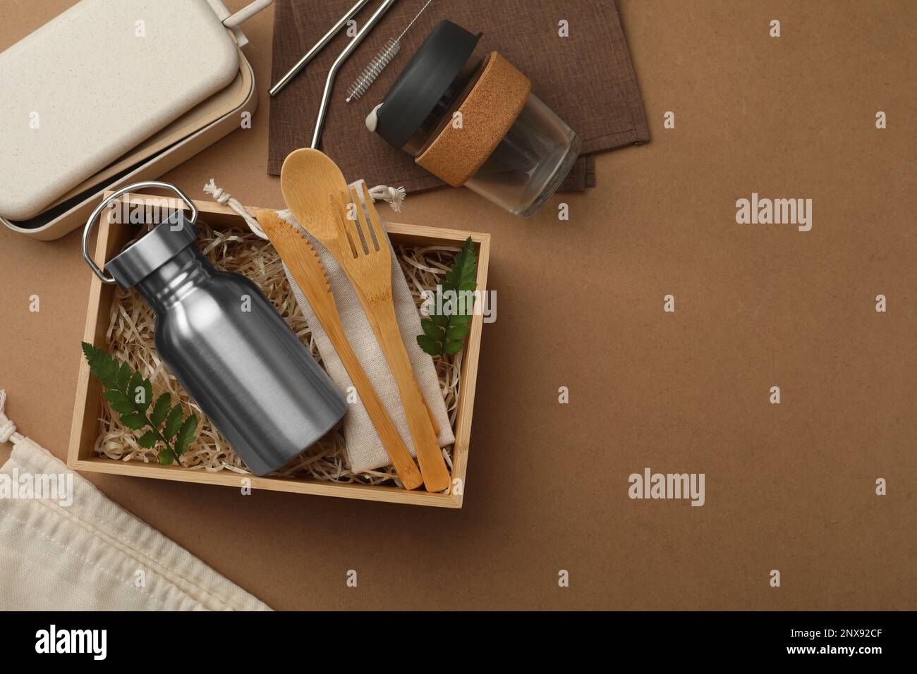 Flat lay composition with eco friendly products on brown background ...