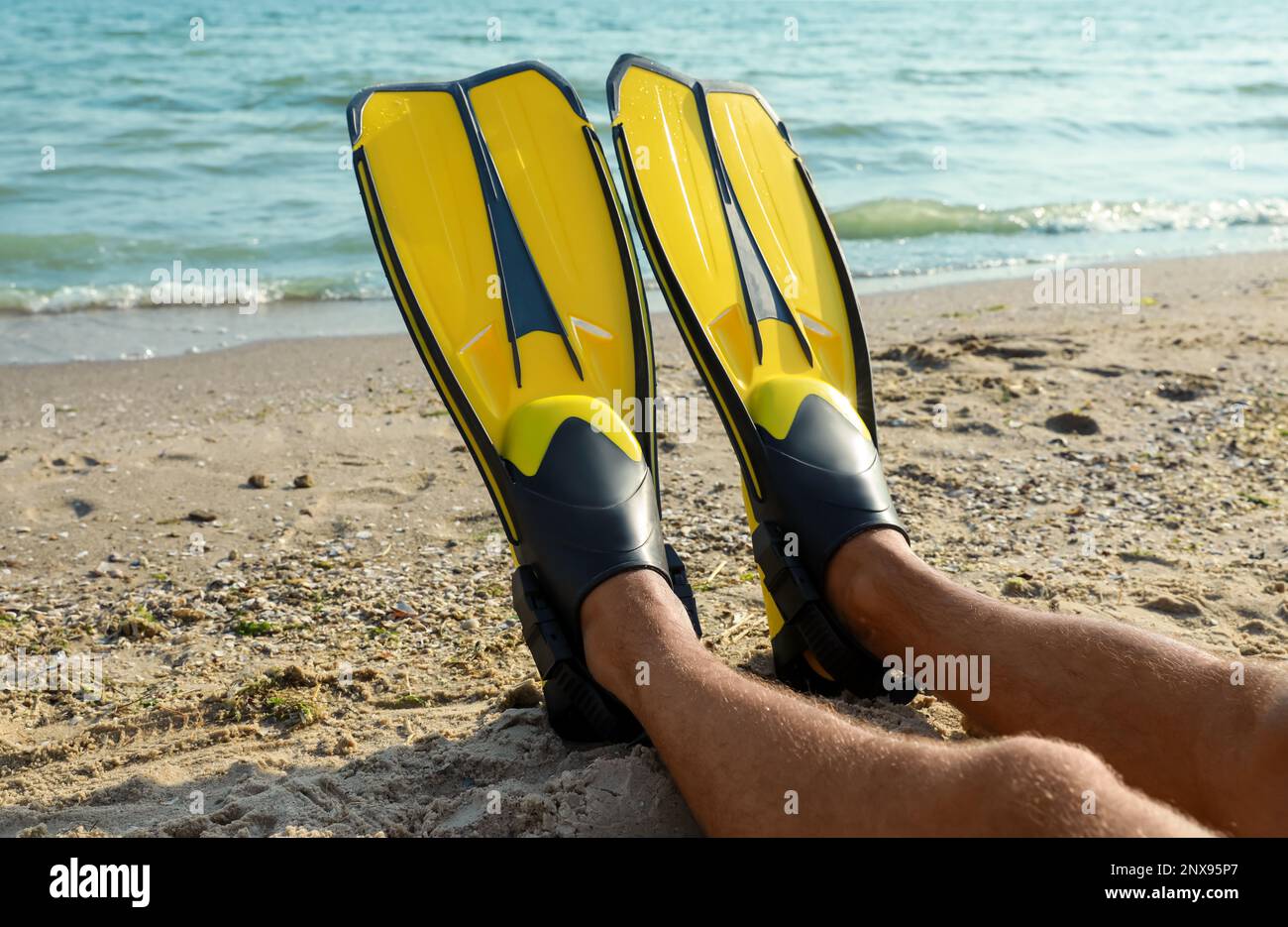 Male legs in flippers hi-res stock photography and images - Alamy