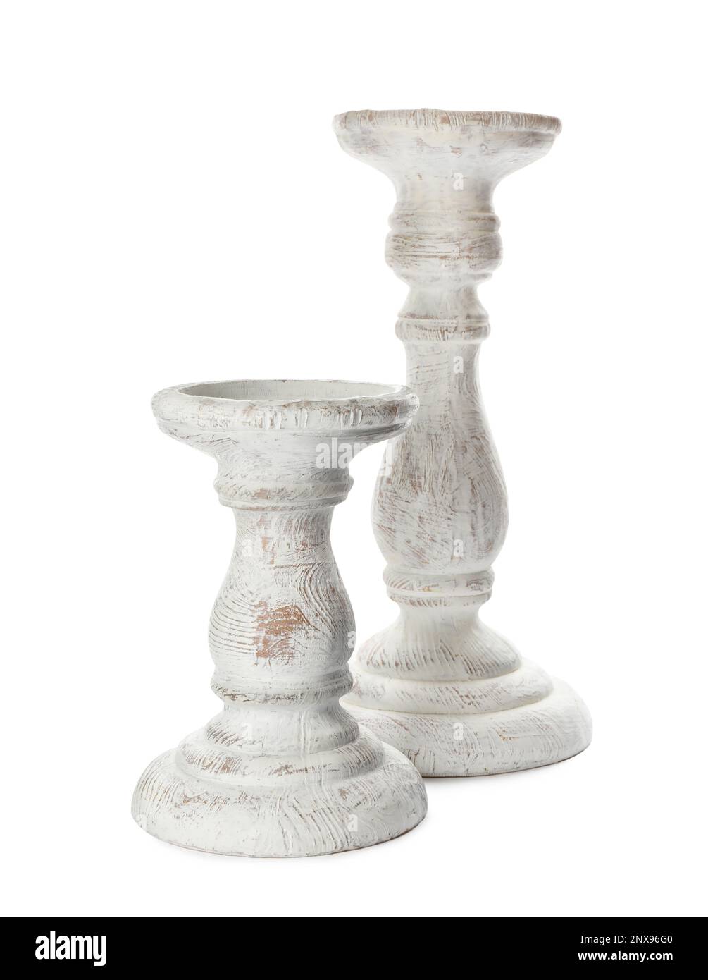 Two stylish wooden candlesticks on white background Stock Photo Alamy