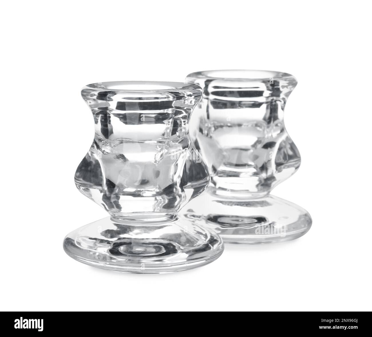 Small modern glass candlesticks on white background Stock Photo Alamy