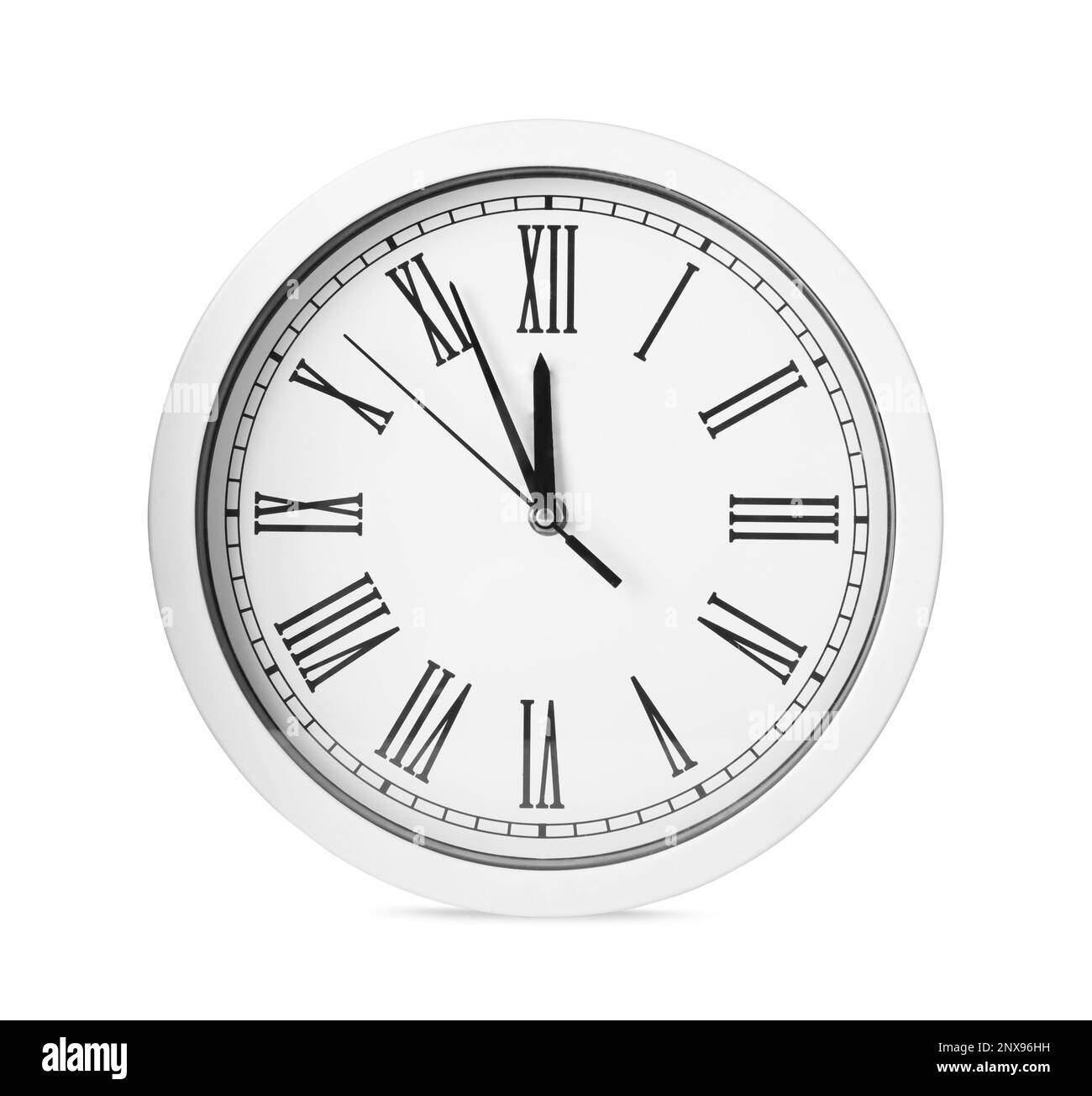 Clock showing five minutes until midnight isolated on white. New Year