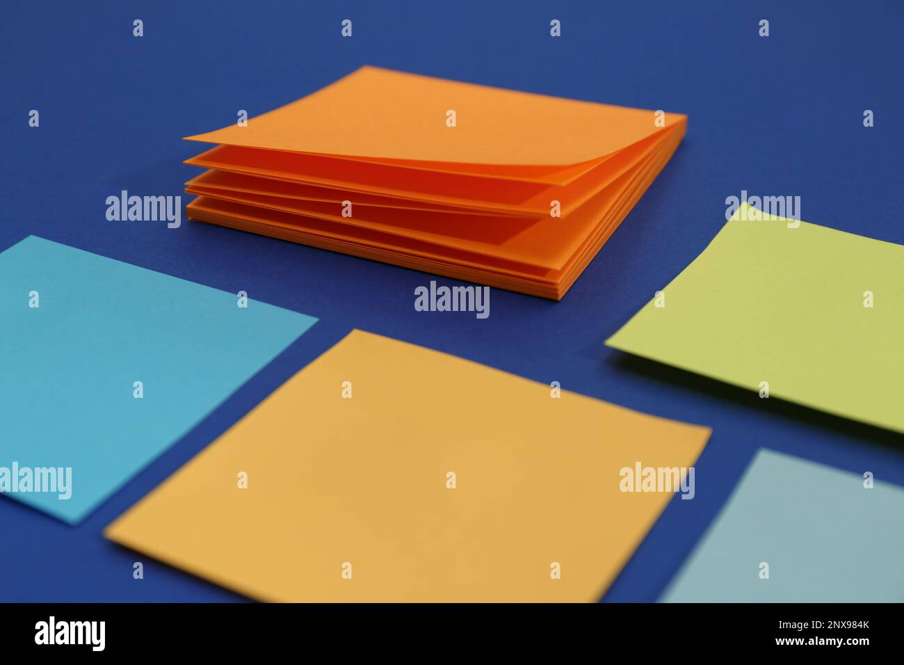 Colorful sticky notes on blue background, closeup Stock Photo - Alamy