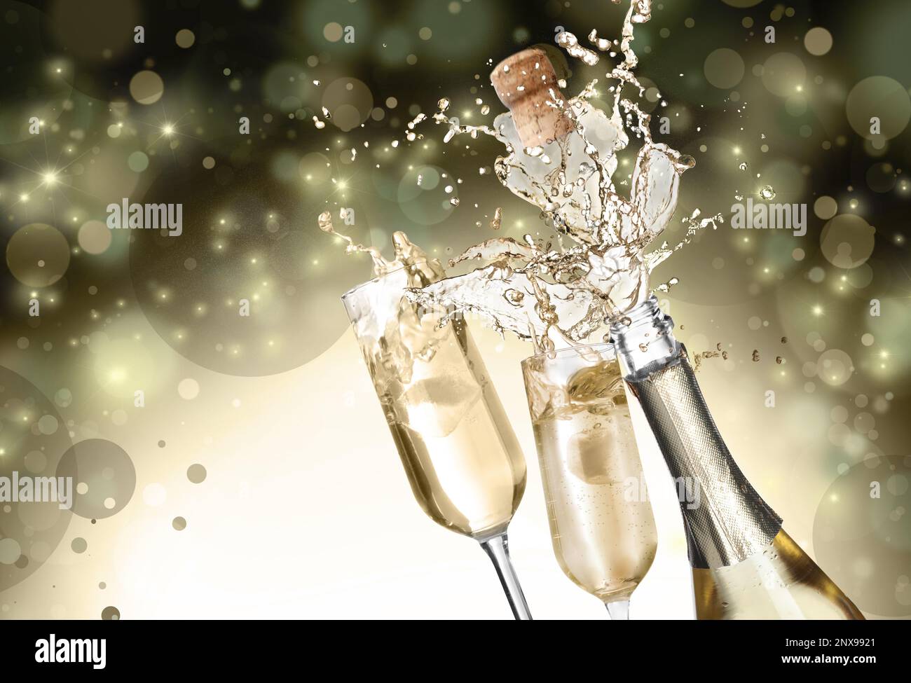 Sparkling wine splashing out of bottle and glasses on color background, bokeh effect Stock Photo