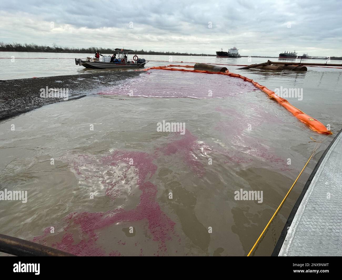 Nine hundred forty feet of the boom being placed around the capsized