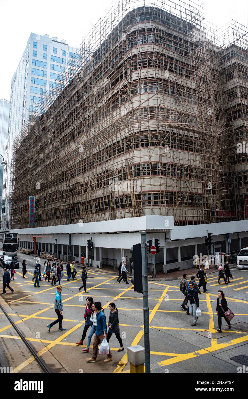 Bamboo scaffolding surrounding a building in central Hong Kong, China. Stock Photo