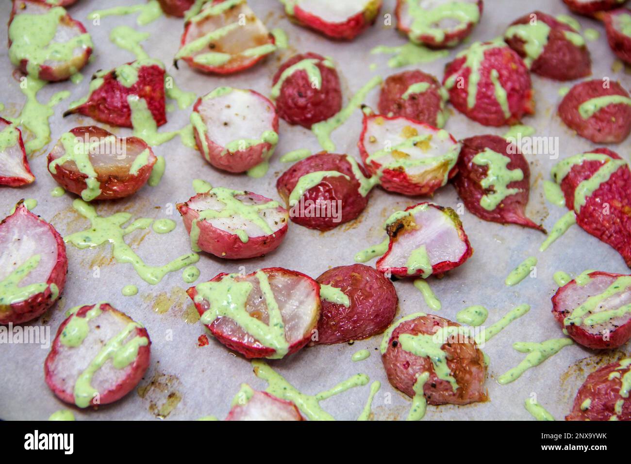 This April 9, 2018, photo shows roasted radishes with green goddess