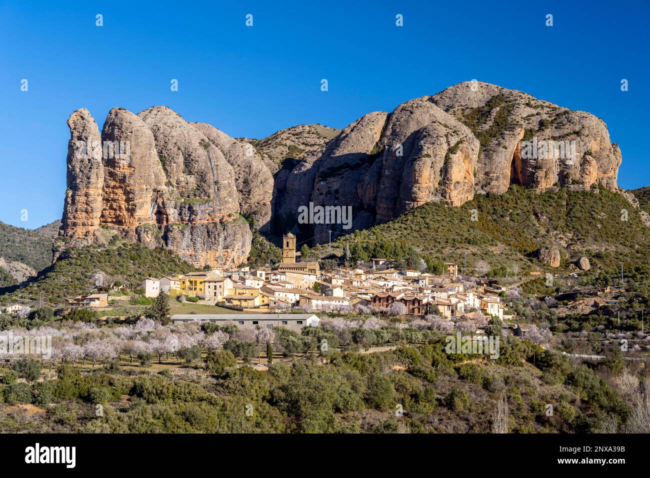 View Of The Village With The Mallos De Aguero Rock Formations Behind View Of The Village With The Mallos De Aguero Rock Formations Behind
