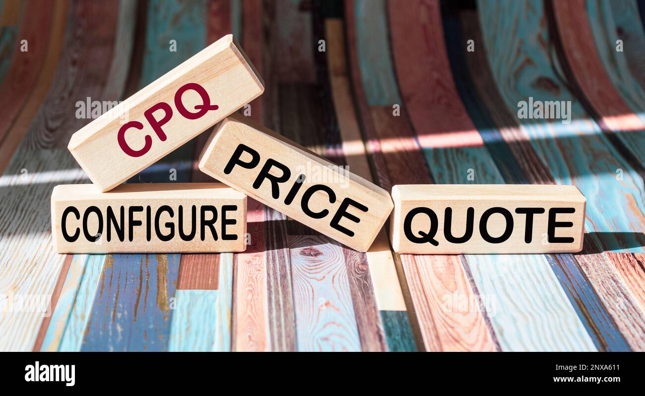 On a vintage background, light wooden blocks and cubes with the text CPQ Configure Price Quote Stock Photo