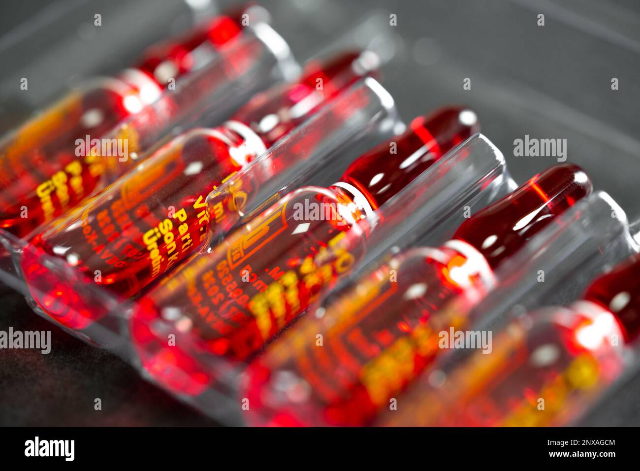 Ampoules with solution for injection used for vitamin B12 supplement, selective focus. B12