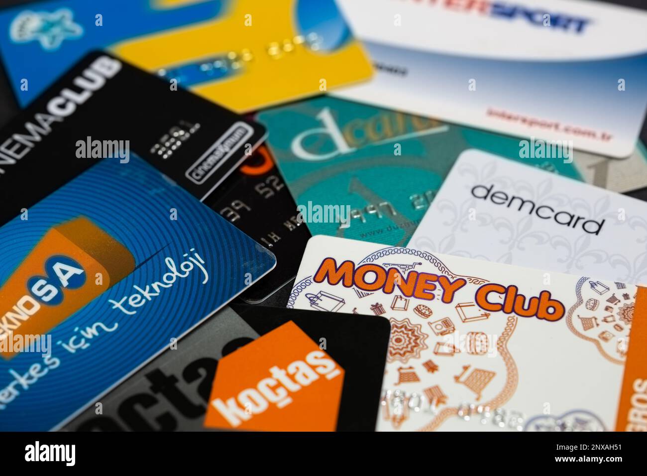 Selective focus on randomly arranged membership, gift and discount cards background of Turkish companies. Stock Photo