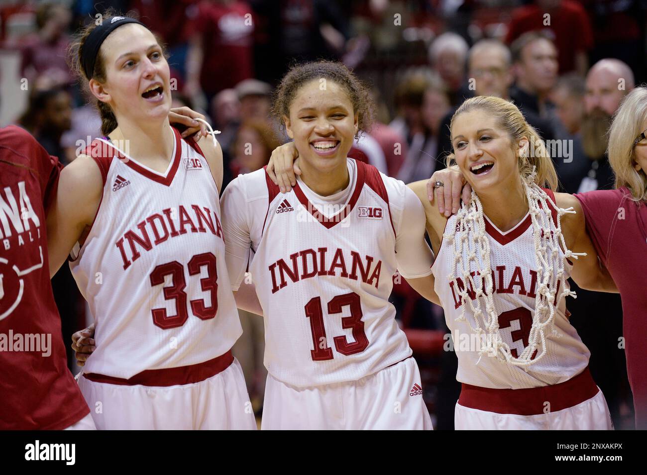 Indiana Hoosiers forward Amanda Cahill (33) Indiana Hoosiers guard Jaelynn  Penn (13) and Indiana Hoosiers guard Tyra Buss (3) sing the alma mater  after the Indiana Virginia Tech WNIT college basketball game