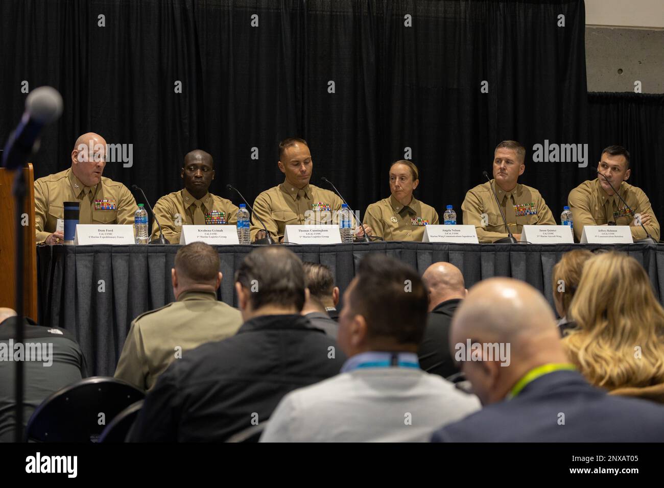 U.S. Marine Corps officers answer questions during the Armed Forces Communications and