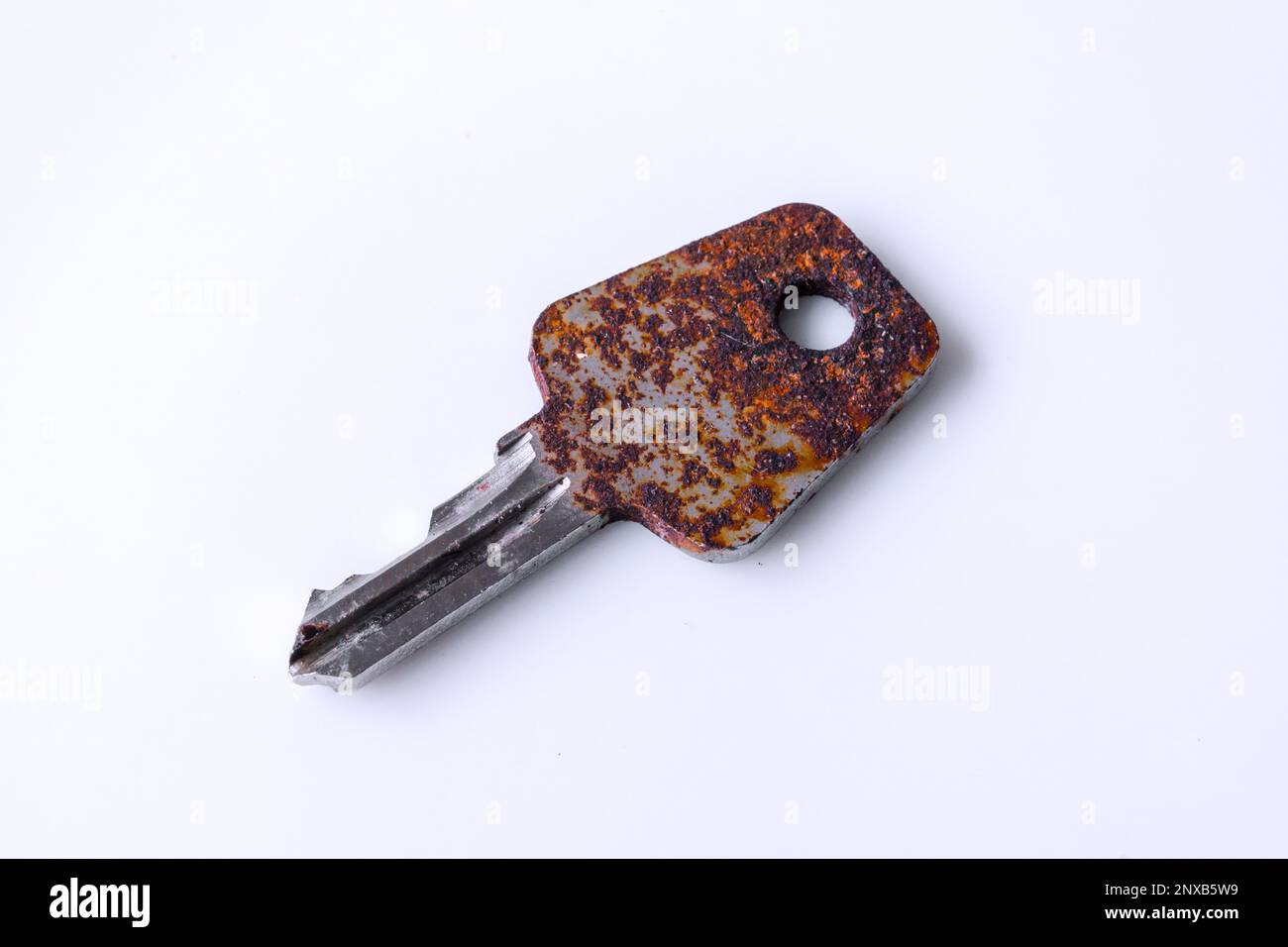 Rusty key on white background Stock Photo