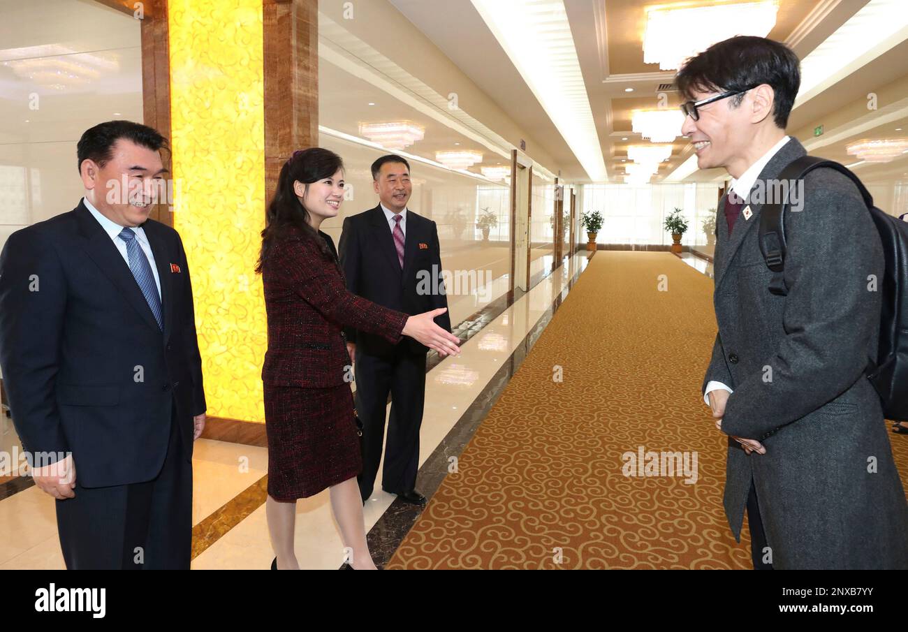 Yun Sang right head of South Korean Art Troupe is greeted by his