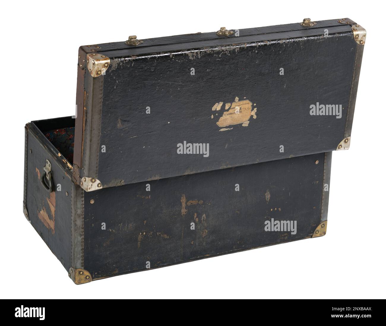 An old fashioned wooden trunk. A black trunk with metal reinforced corners and leather trimmed edges. Stock Photo