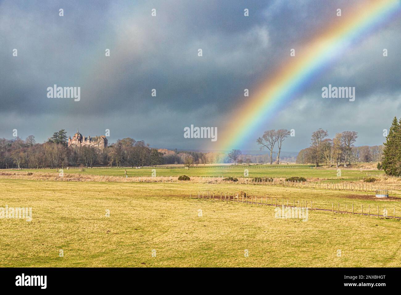 A rainbow over Thirlestane Castle beside Leader Water at Lauder, Scottish Borders, Scotland UK Stock Photo